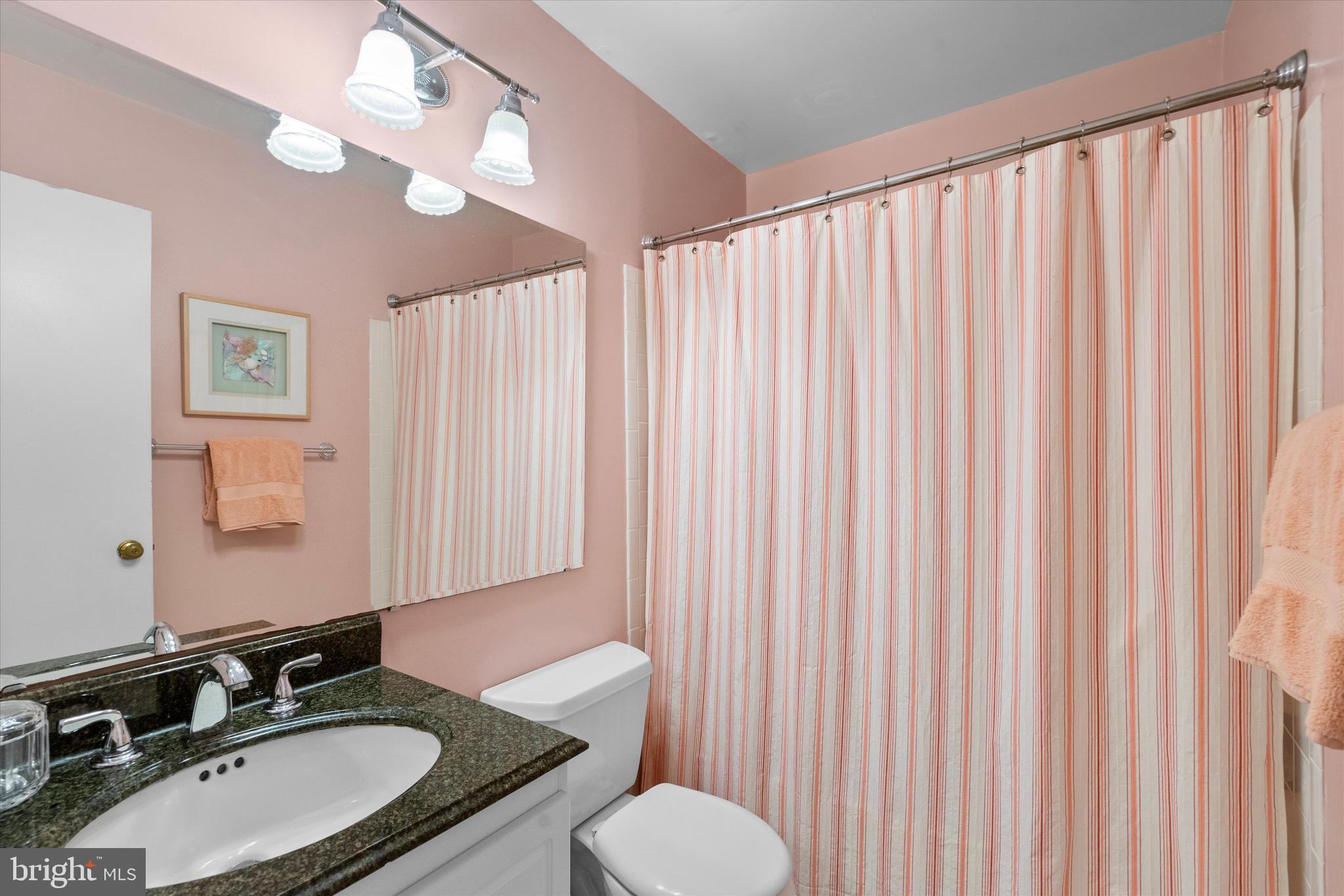 5504 Winford Court Fairfax, VA 22032 - Photo 33 of 61 a bathroom with a granite countertop sink and a mirror