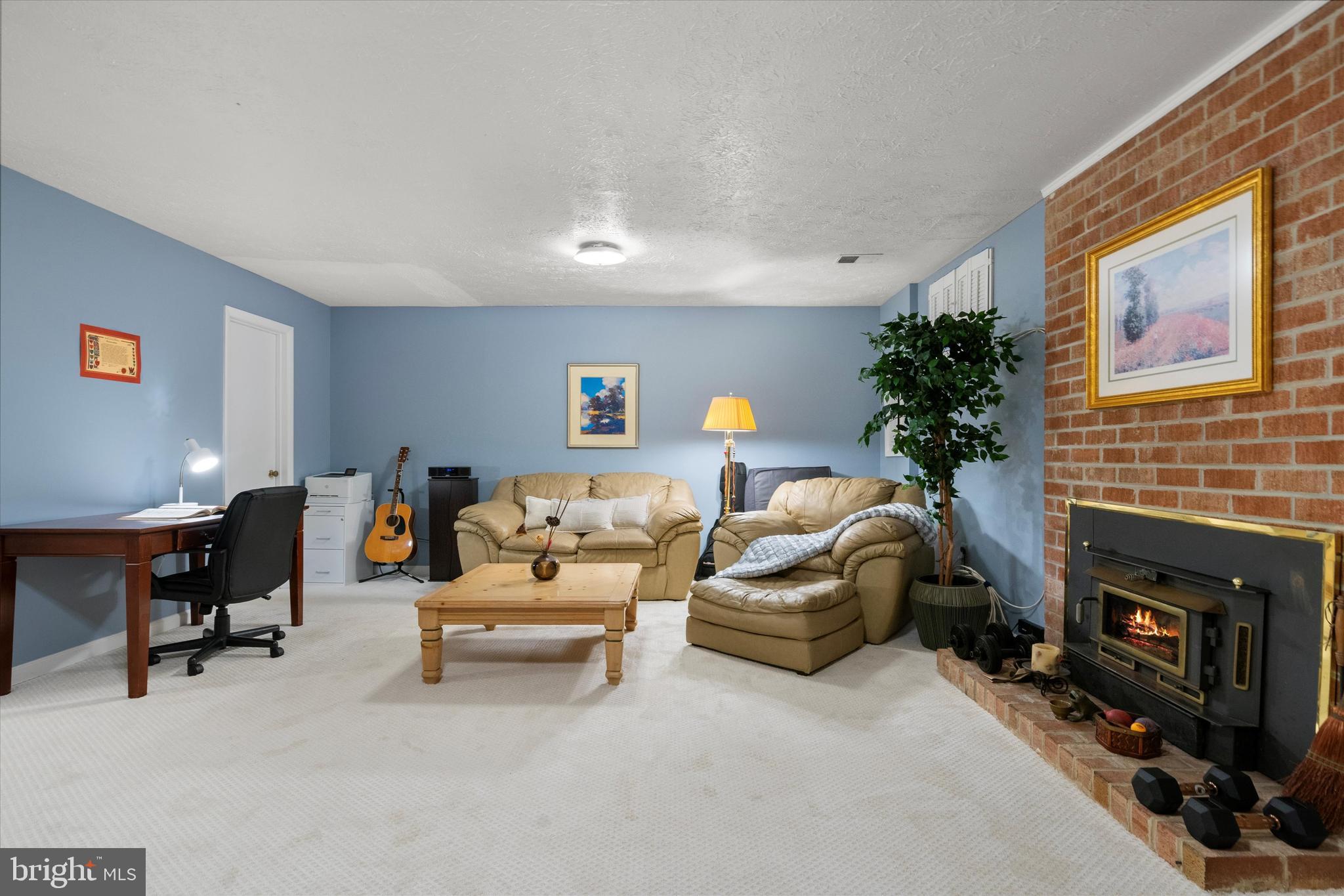 5504 Winford Court Fairfax, VA 22032 - Photo 41 of 61 a living room with furniture and a fireplace