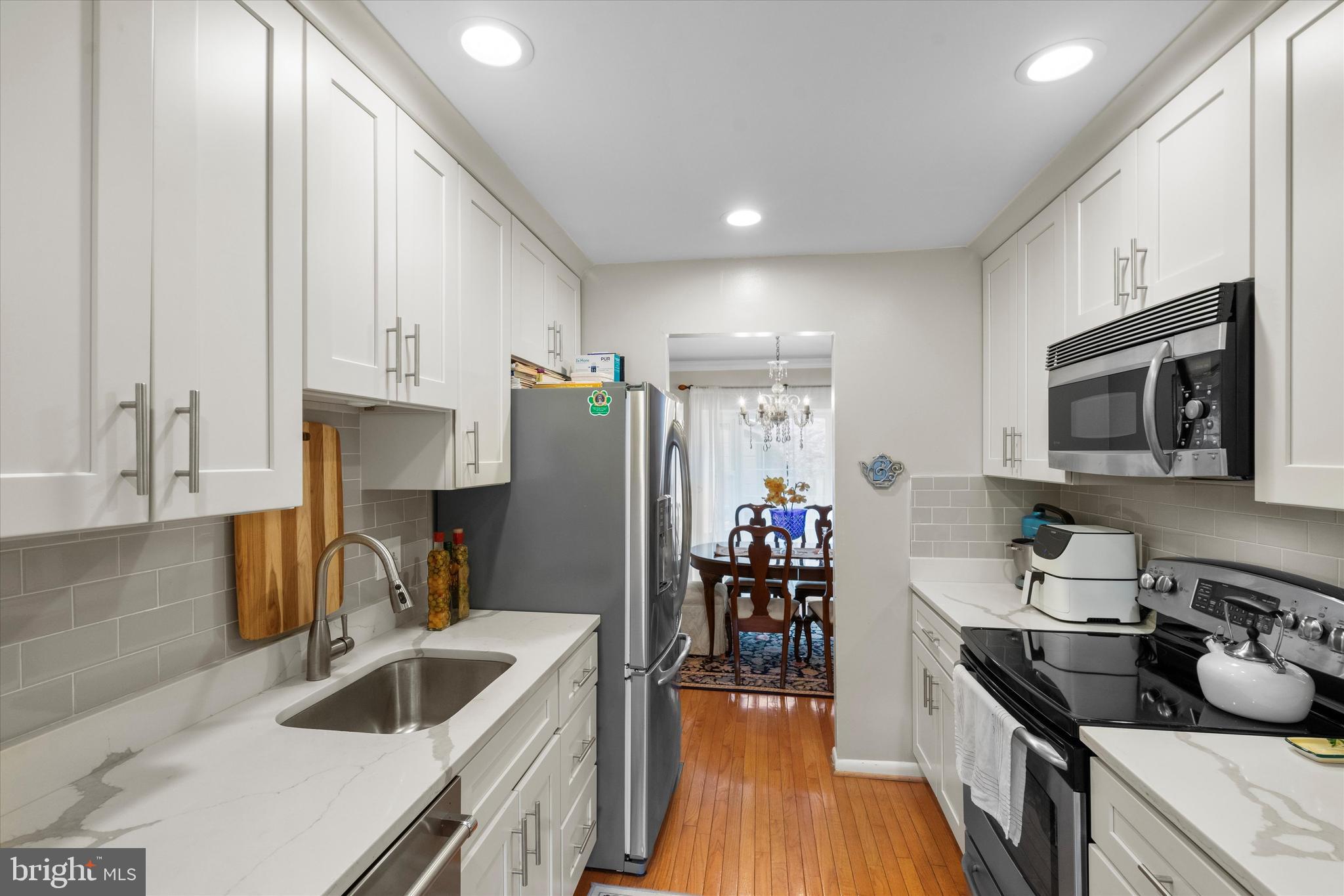 5504 Winford Court Fairfax, VA 22032 - Photo 10 of 61 a kitchen with granite countertop a sink cabinets and stainless steel appliances