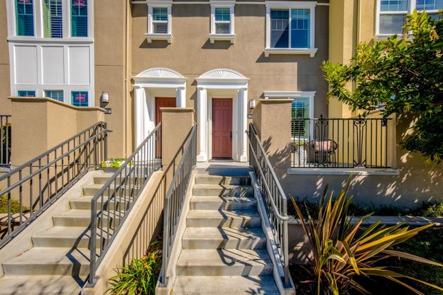 a balcony with table and chairs