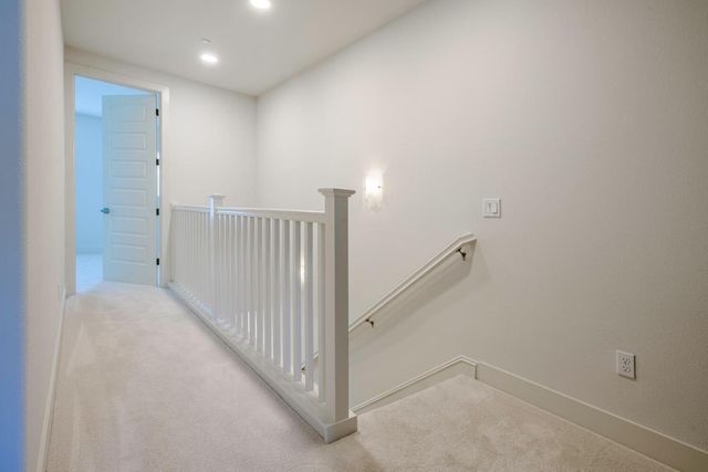 a view of a hallway with staircase