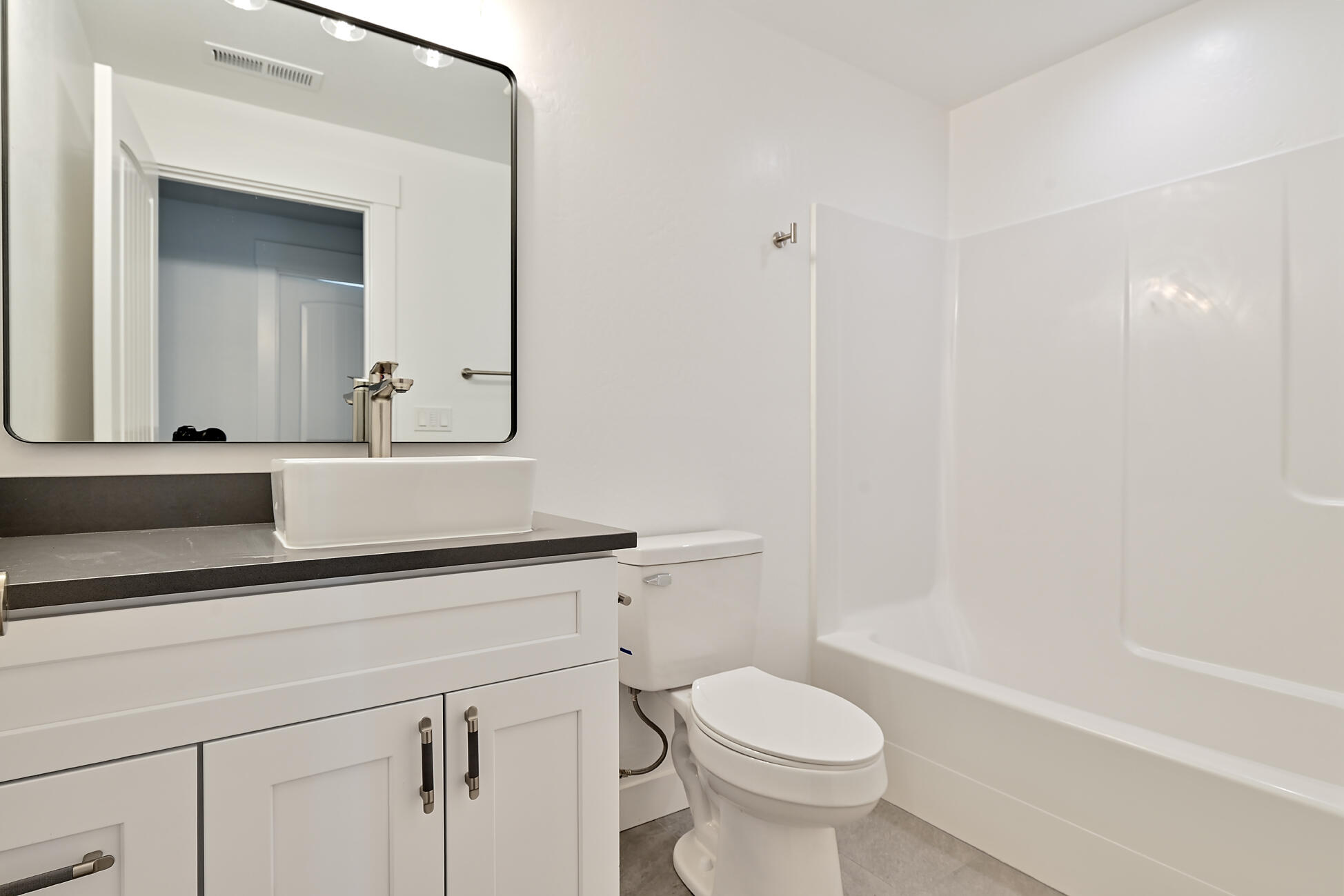 267 Samuel Lane Loop Road Phoenix, OR 97535 - Photo 6 of 16 a bathroom with a sink a toilet a mirror and shower