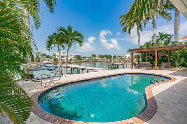 a view of a swimming pool with a patio