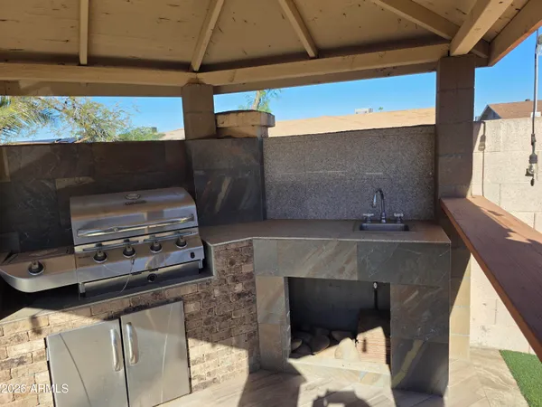 a living room with chairs and a stove