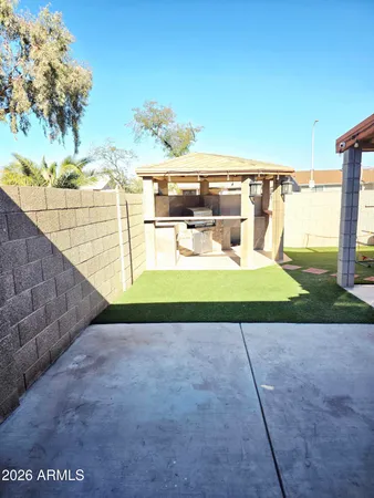 a view of a swimming pool with a yard