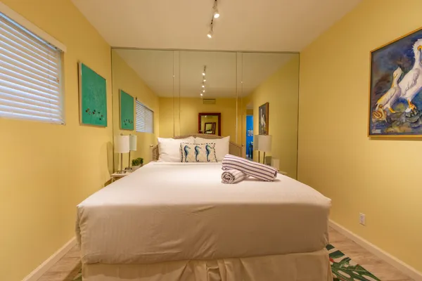 a bedroom with a bed and a dresser