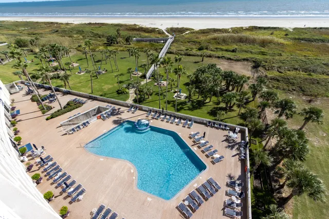 a bed room with furniture and wooden floor