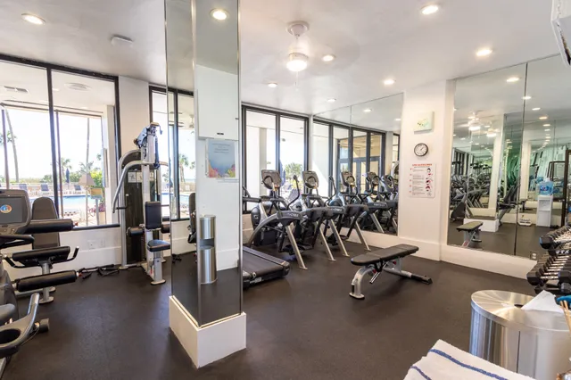 a view of a swimming pool with outdoor seating