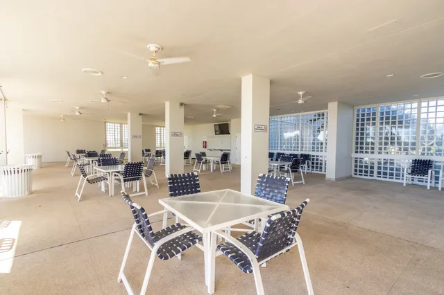a view of a swimming pool and lounge chair