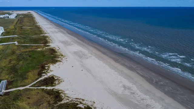 a picture of a building with a yard
