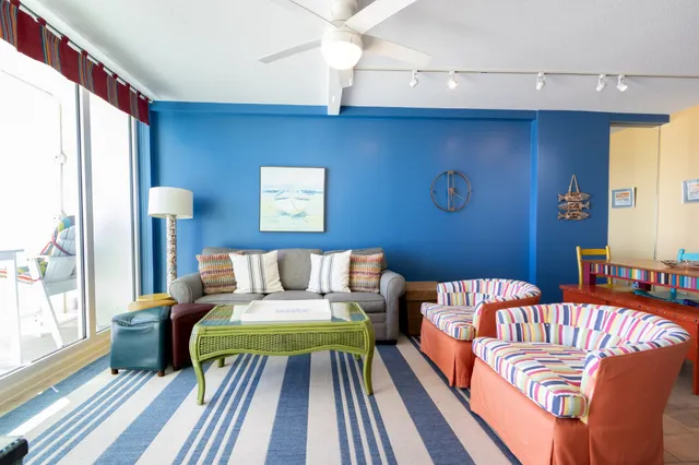 a living room with furniture and a rug