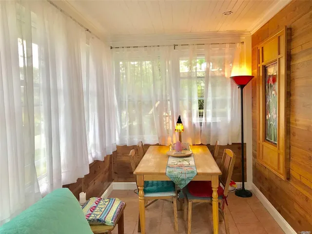 a bed room with furniture and a window