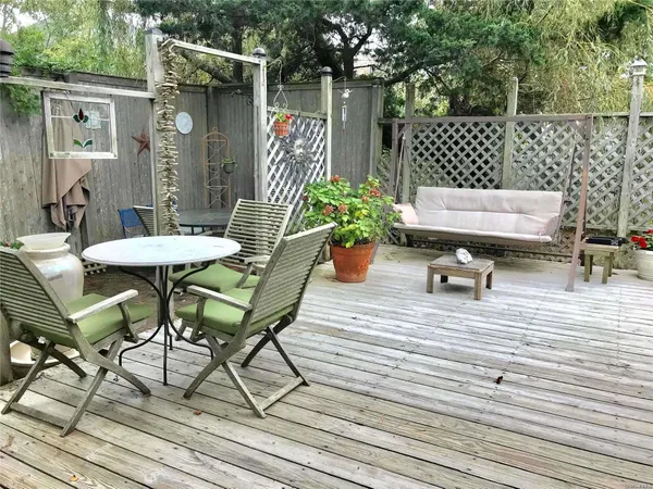 a backyard of a house with seating space