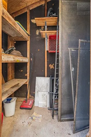 a view of house with swimming pool and porch