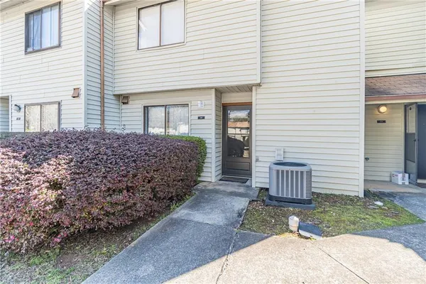 a view of a house with a yard and garage
