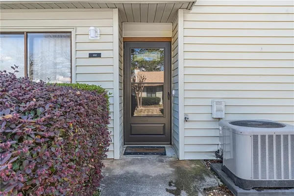 a view of entryway with wooden floor and stairs
