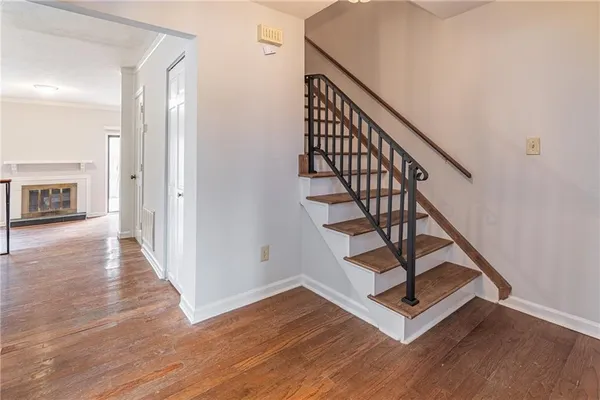a view of an entryway with wooden floor