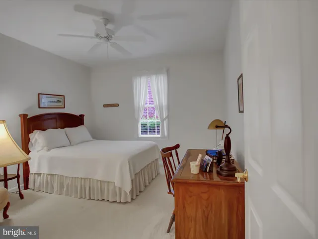 a bedroom with a bed and dresser