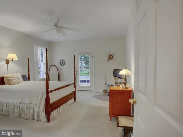 a room with a bed and a chandelier