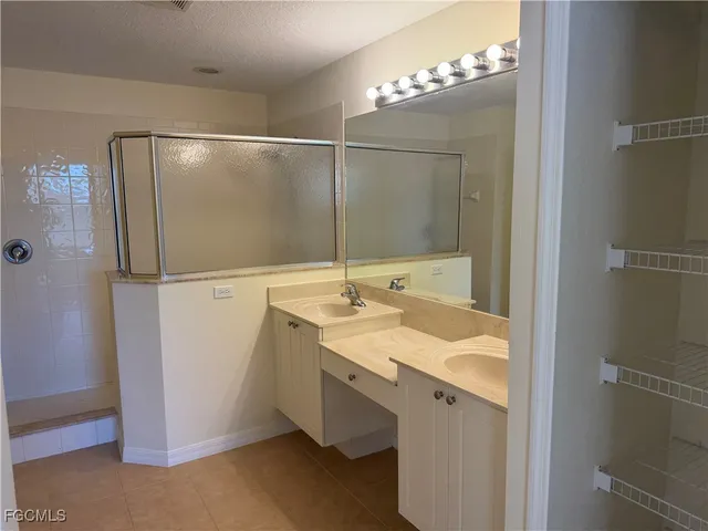a bathroom with a sink and mirror