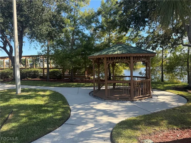 a view of a swimming pool with sitting area