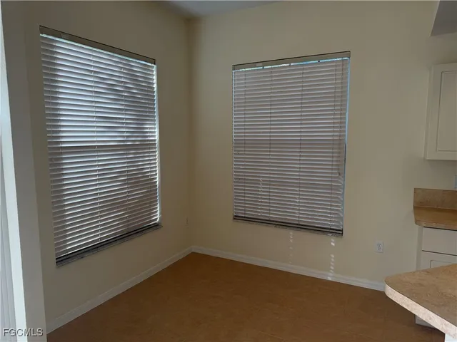a view of a room that has a window in it