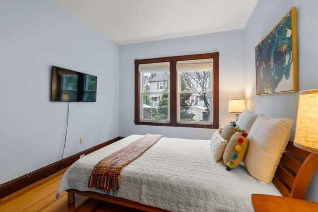 a bedroom with a bed and window