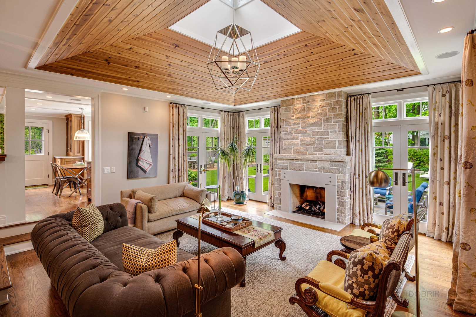 50 Ravine Forest Drive Lake Bluff, IL 60044 - Photo 13 of 44 a living room with furniture a fireplace and a chandelier