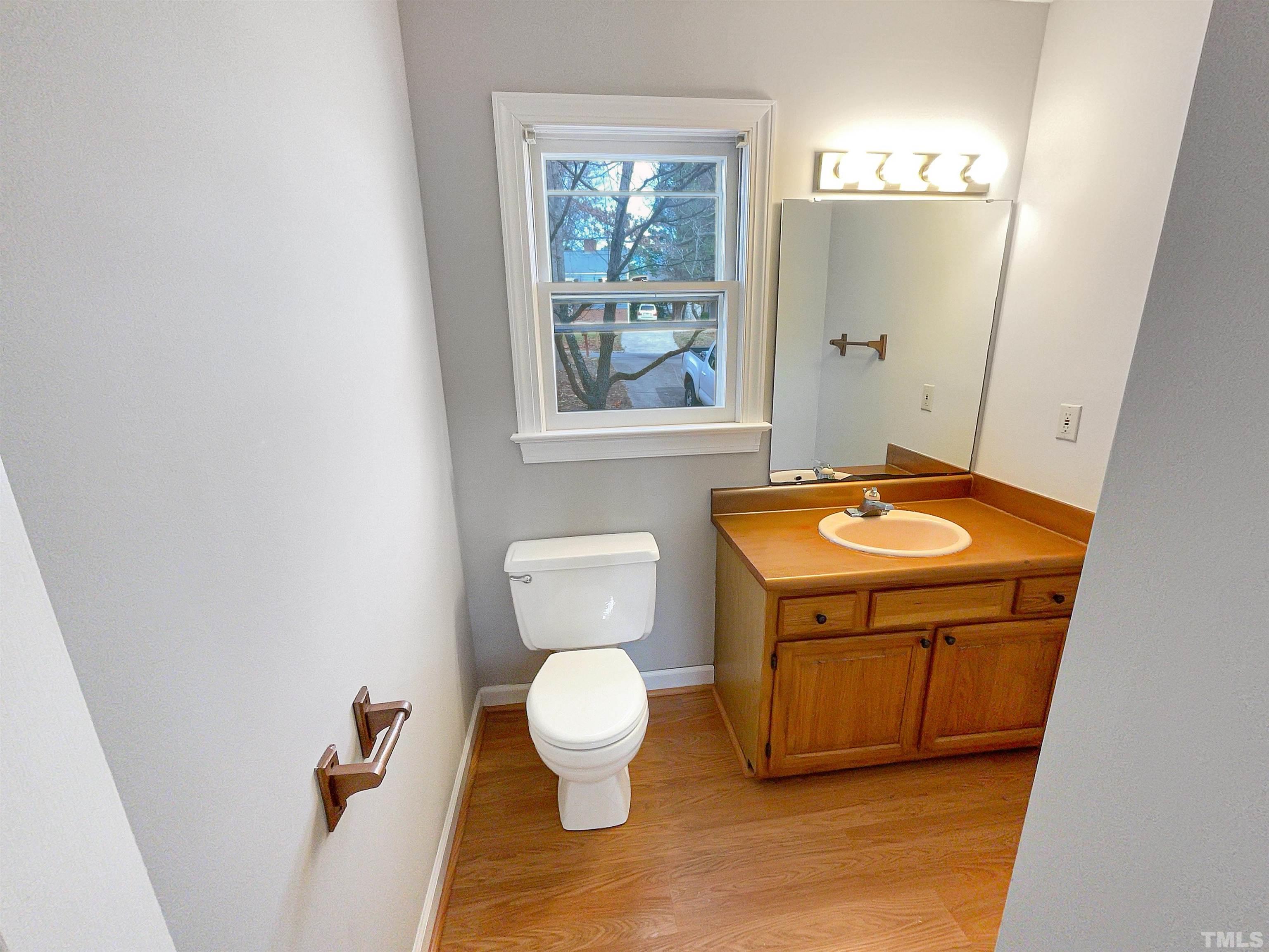 6900 Three Bridges Circle Raleigh, NC 27613 - Photo 11 of 20 a bathroom with a toilet sink and mirror