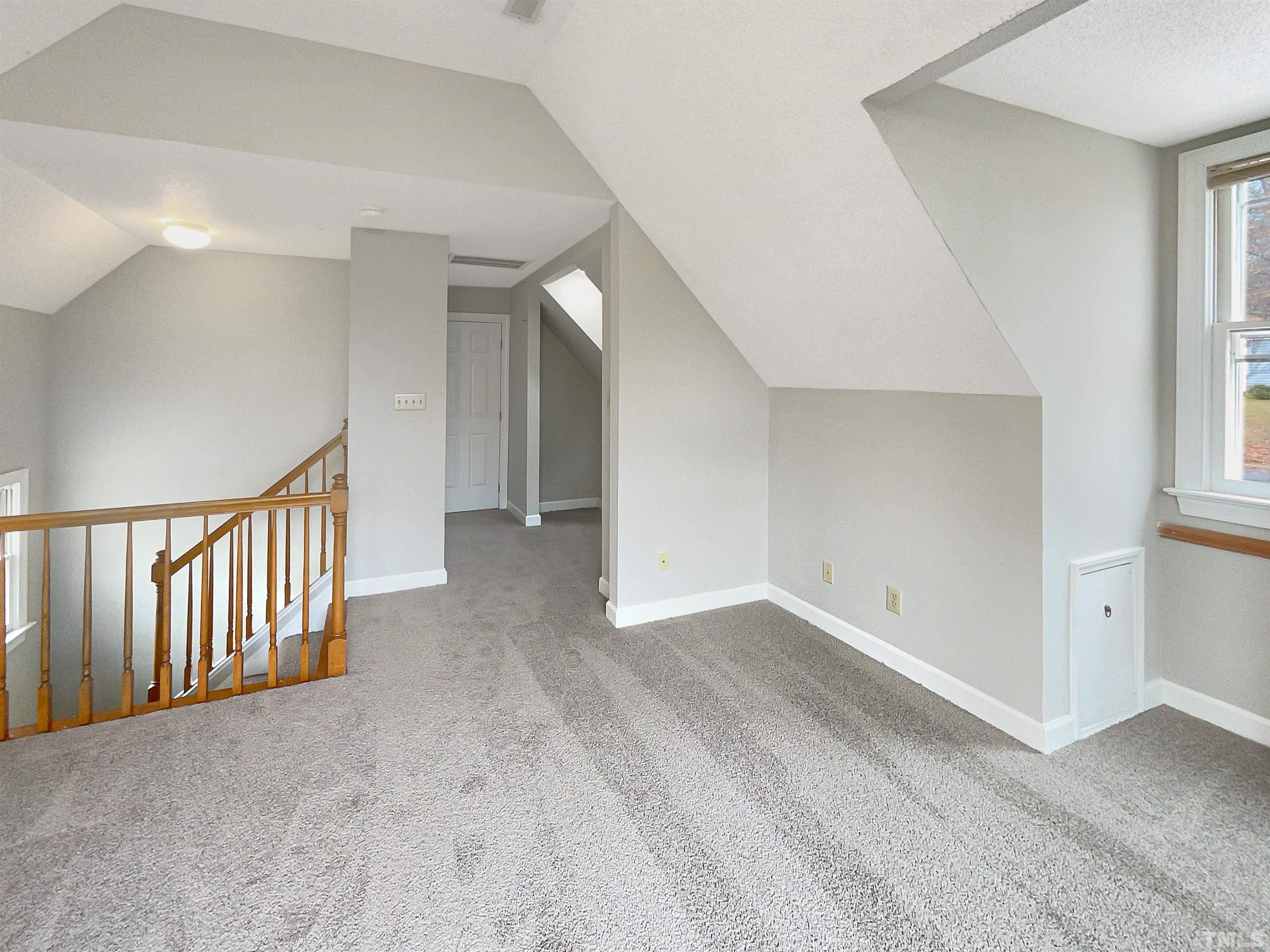 6900 Three Bridges Circle Raleigh, NC 27613 - Photo 13 of 20 a view of an empty room with stairs