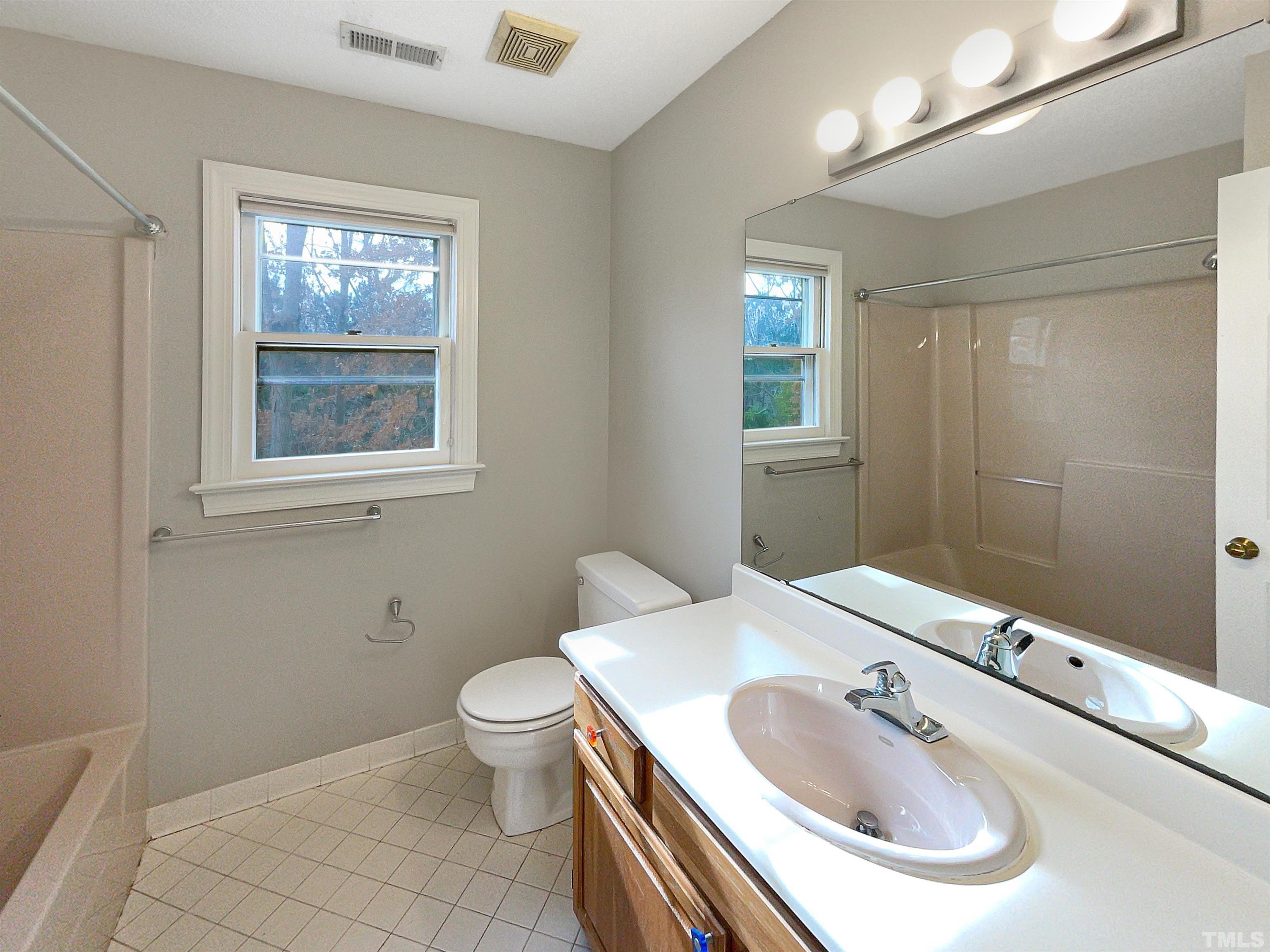 6900 Three Bridges Circle Raleigh, NC 27613 - Photo 16 of 20 a bathroom with a sink toilet and shower