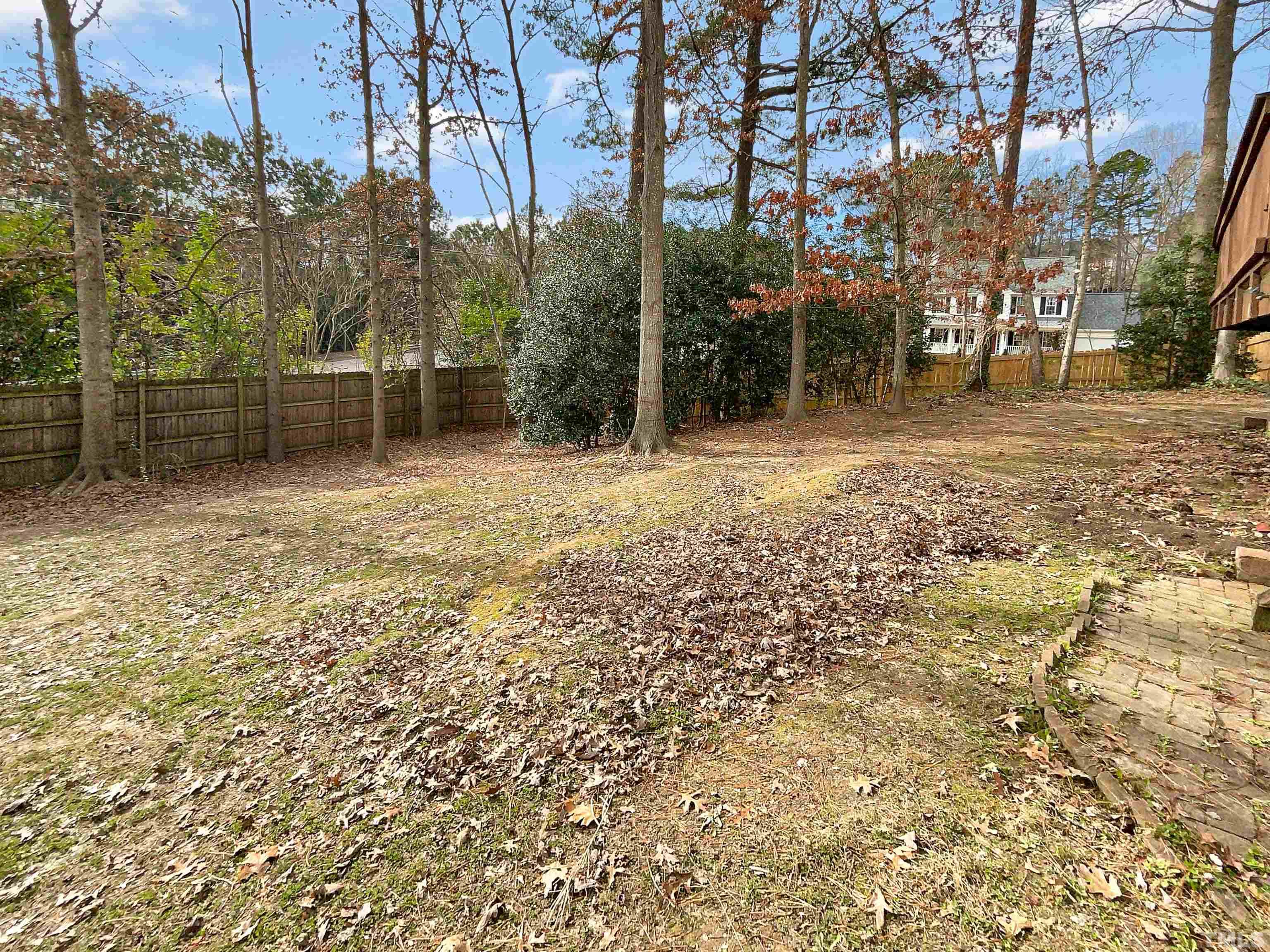 6900 Three Bridges Circle Raleigh, NC 27613 - Photo 20 of 20 a backyard of a house with lots of green space