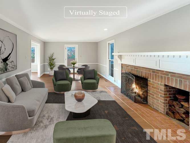 6900 Three Bridges Circle Raleigh, NC 27613 - Photo 2 of 20 a living room with furniture and a fireplace