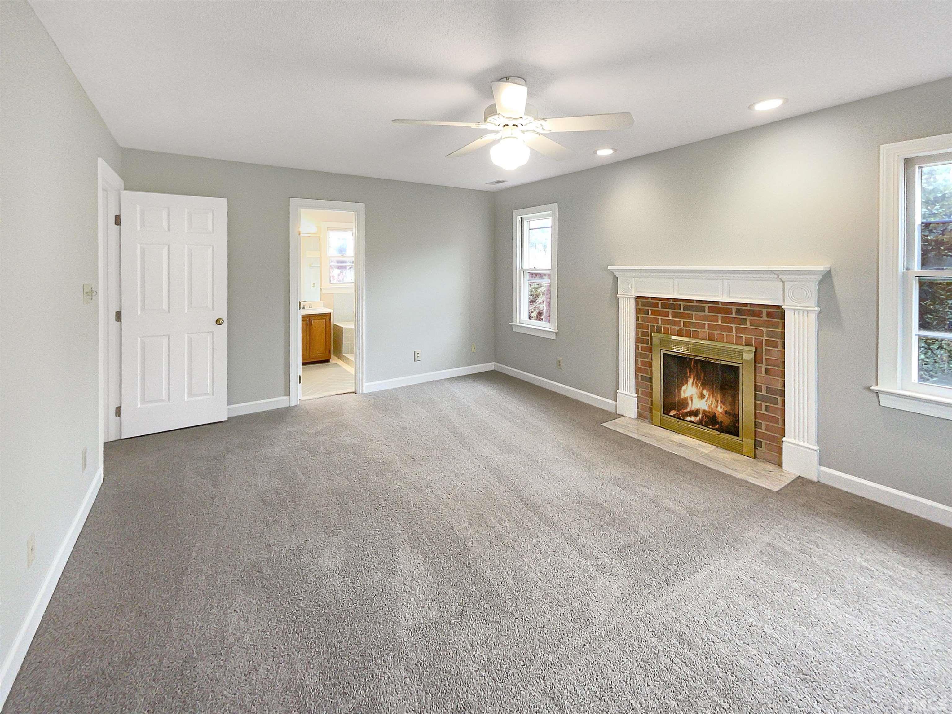 6900 Three Bridges Circle Raleigh, NC 27613 - Photo 6 of 20 a view of an empty room with window and fireplace