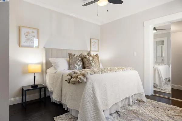 a bedroom with a bed and a lamp