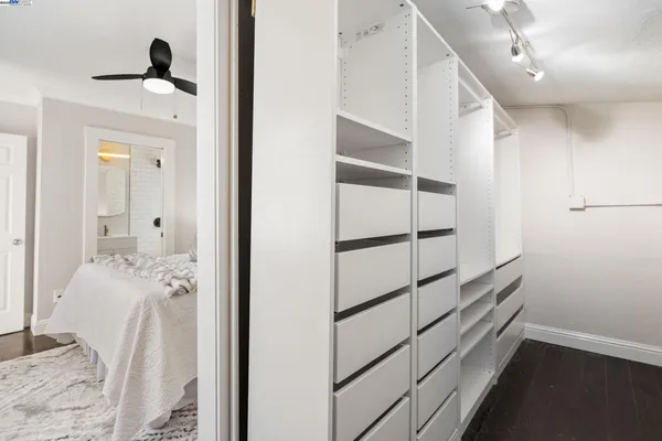 a bedroom with a bed and a couch