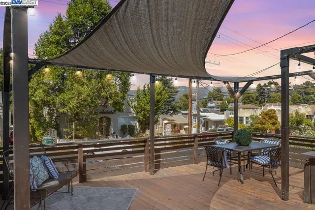 a view of two chairs in the balcony