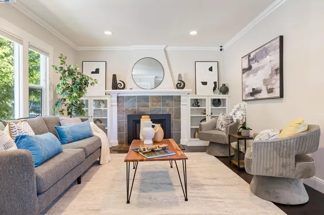 a living room with furniture and a fireplace