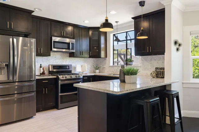 a kitchen with a sink stove and microwave