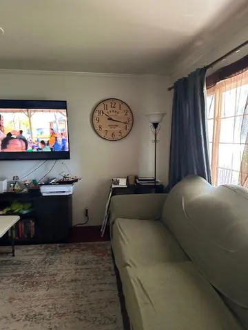 a bed room with a bed and a flat screen tv