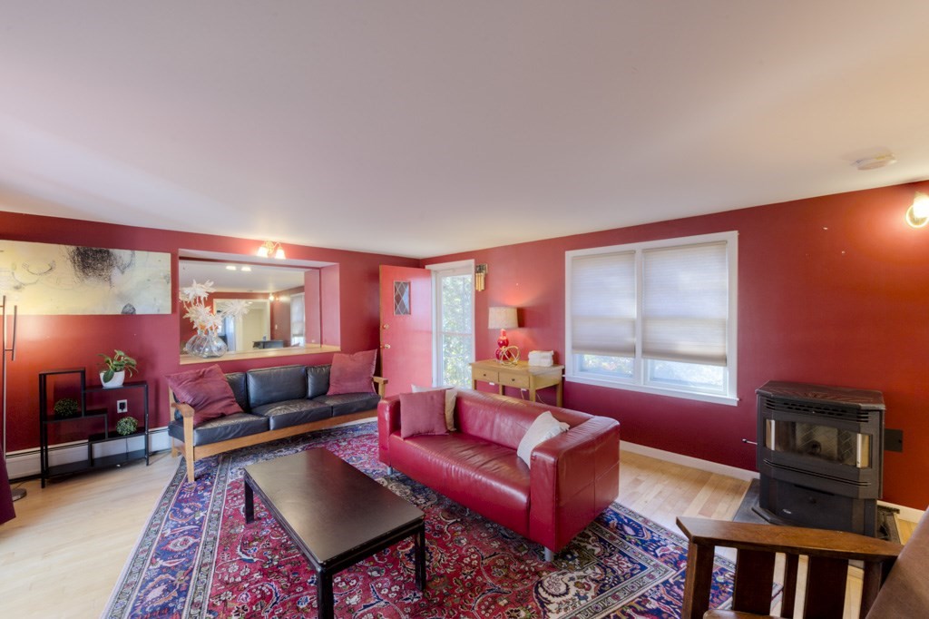 18 Bergin Lane Worcester, MA 01602 - Photo 14 of 42 a living room with furniture a rug and a window