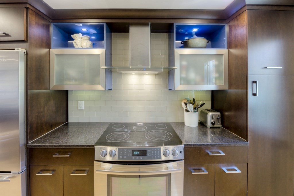 18 Bergin Lane Worcester, MA 01602 - Photo 20 of 42 a stove top oven sitting inside of a kitchen
