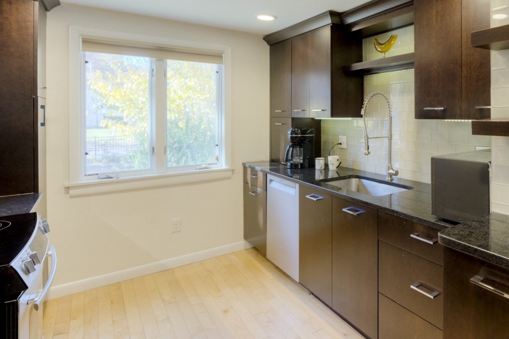 18 Bergin Lane Worcester, MA 01602 - Photo 21 of 42 a kitchen with a sink appliances and cabinets