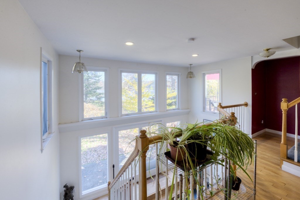 18 Bergin Lane Worcester, MA 01602 - Photo 24 of 42 a view of hallway with wooden floor and windows