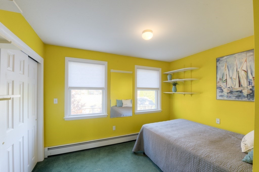 18 Bergin Lane Worcester, MA 01602 - Photo 32 of 42 a bedroom with a bed and wooden floor