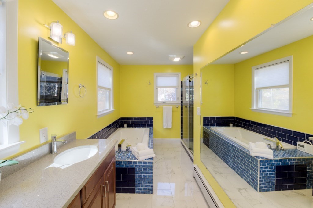 18 Bergin Lane Worcester, MA 01602 - Photo 34 of 42 a bathroom with a granite countertop sink and a bathtub