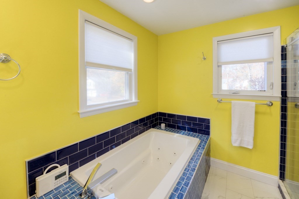 18 Bergin Lane Worcester, MA 01602 - Photo 35 of 42 a bathroom with a bathtub and a window