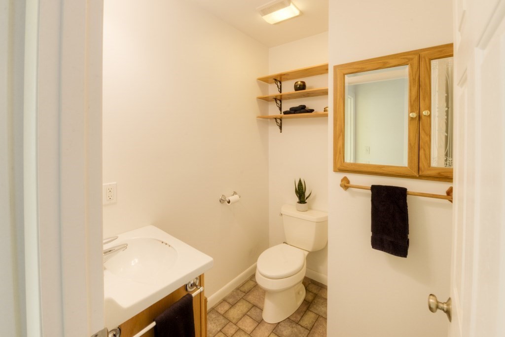 18 Bergin Lane Worcester, MA 01602 - Photo 38 of 42 a bathroom with a toilet and a sink
