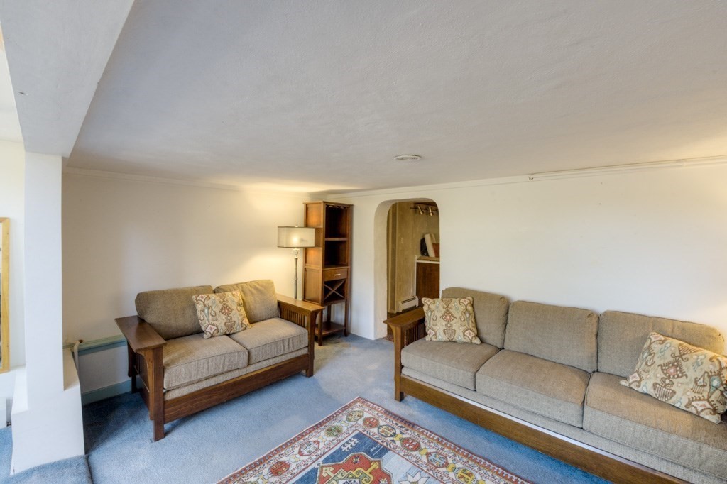 18 Bergin Lane Worcester, MA 01602 - Photo 41 of 42 a living room with furniture and a couch