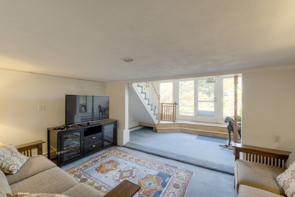 18 Bergin Lane Worcester, MA 01602 - Photo 42 of 42 a living room with furniture and a flat screen tv